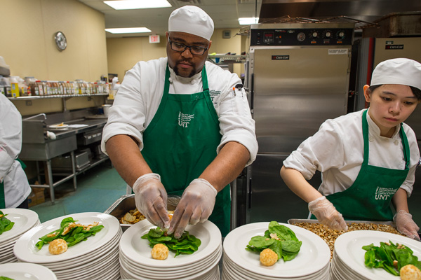 Students prepare meals in the Club at the Gateway restaurant