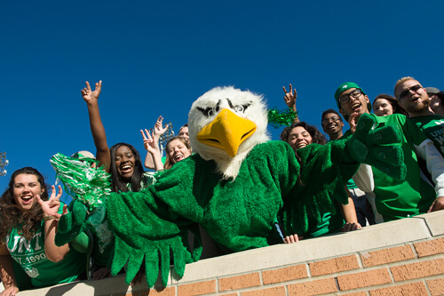 Fans with UNT mascot Scrappy at Apogee Stadium