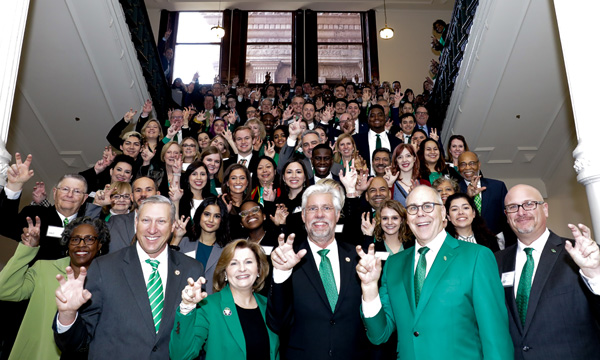 UNT alumni, students and friends gather at the stairwell in the UNT Hurley Administration Building