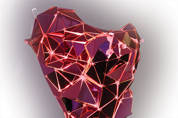 The art of innovation, 3D geometric heart shape, made up of triangular facets