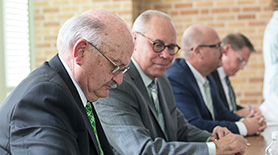 UNT Foundation Chair, Bob Sherman signs a contract after the UNT Foundation awarded a $30,000 endowment to each of the 13 colleges in UNT's Denton system