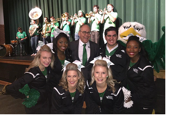 President Smatresk, with UNT cheerleaders, Scrappy and UNT band.